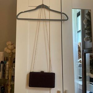 Clutch bag, sparkling burgundy color. Perfect condition